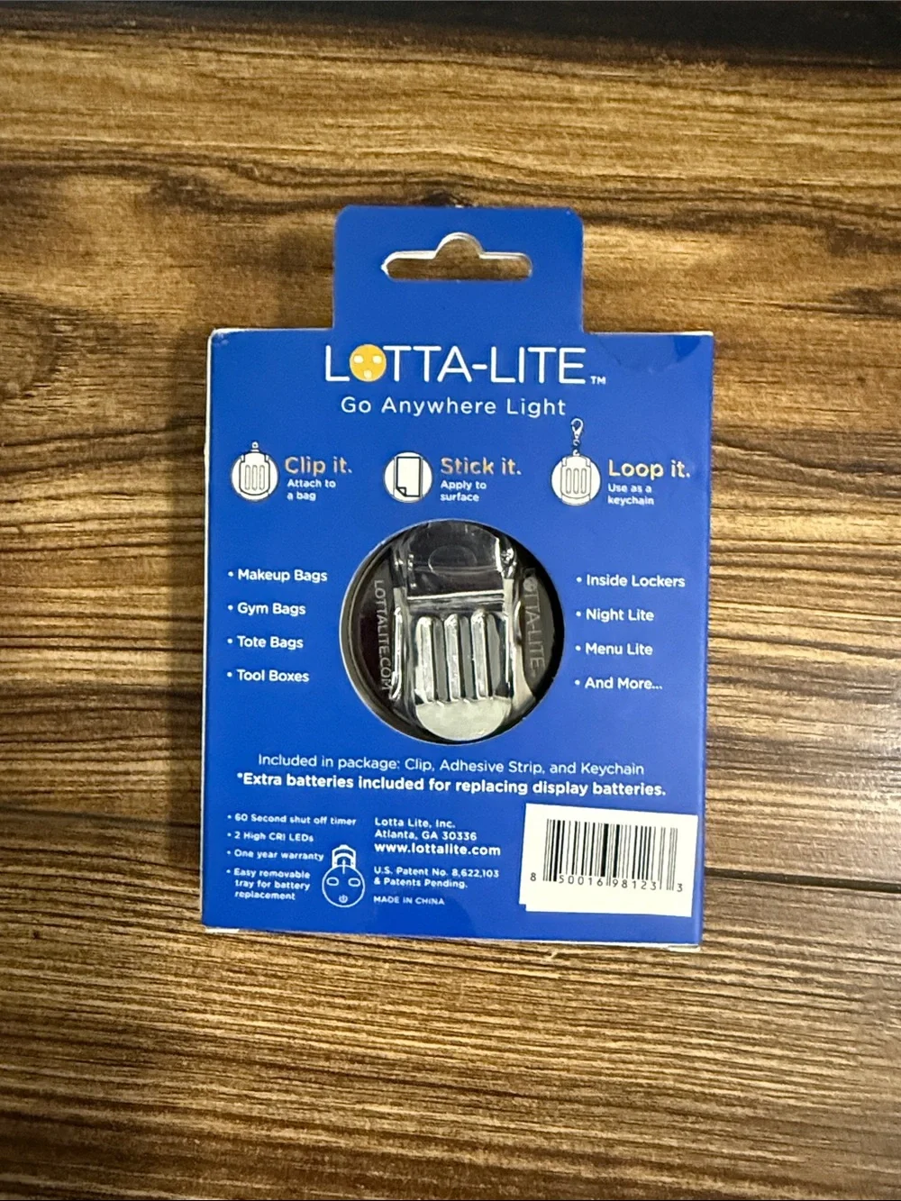 The snakeskin Lotta-Lite graphic-print LED clip-on light.